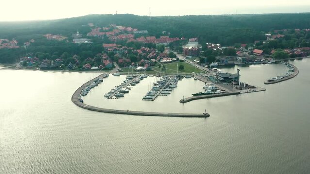 drone footage of Nida town in Lithuania, harbor and town can be seen in this clip, shot at sunny summer day