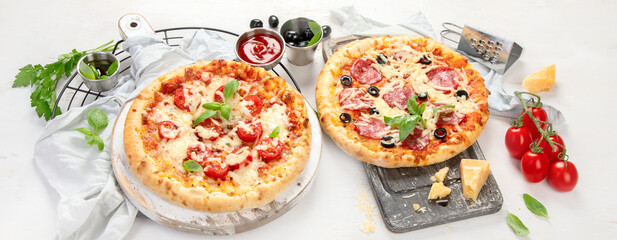Fototapeta na wymiar Freshly baked pizza on dark background.