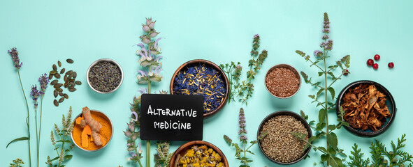 Alternative herbal medicine on green background. - obrazy, fototapety, plakaty