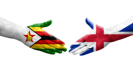 Handshake between Great Britain and Zimbabwe flags painted on hands, isolated transparent image. - obrazy, fototapety, plakaty