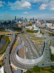 Naklejka premium Aerial vertical view of Brisbane city and highway traffic in Australia in daytime