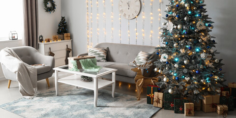 Stylish interior of living room with Christmas tree and cozy furniture