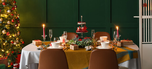 Dining table with beautiful setting for Christmas celebration at home