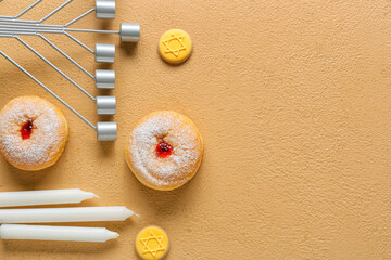 Composition with menorah, candles, cookies and donuts for Hanukkah celebration on color background