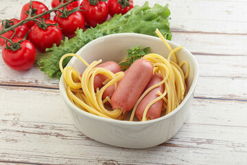 Mini sausages with pasta spaghetti