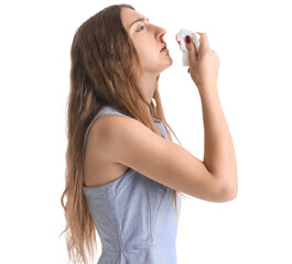 Young woman with nosebleed and tissue on white background