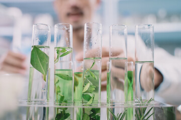 Close up tube on researchers hands. Researcher are looking to simples reefs in tube on his hands at cosmetic lab and laboratory