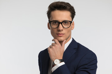 close up picture of thoughtful businessman with eyeglasses thinking