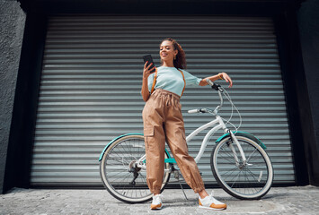 Bicycle, phone and black woman in city, street or urban road outdoors. Bike, travel and happy...