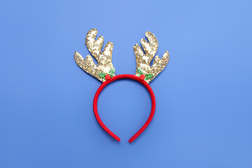 Christmas reindeer horns on blue background