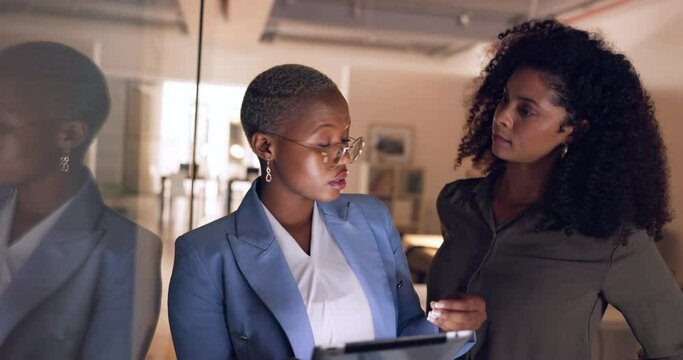 Business people, tablet or talking in night office for digital marketing startup, creative company or project management teamwork. Designer, worker or black woman on technology for strategy planning
