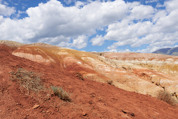 The Red Mountains of Altai, Mars - 1. Red mountains on the background of the blue sky with clouds.