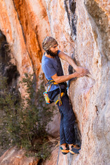 Rock climber climbing rock