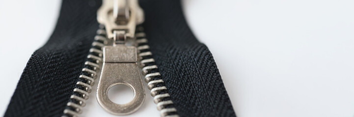 Closeup macro shot of open black brass zipper isolated on white background © megaflopp