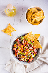 Homemade cowboy caviar traditional mexican vegetable salad and nachos in a bowl. Top and vertical view