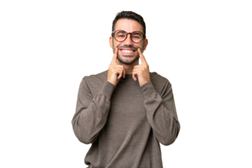 Young handsome caucasian man over isolated background smiling with a happy and pleasant expression