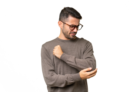 Young handsome caucasian man over isolated background with pain in elbow