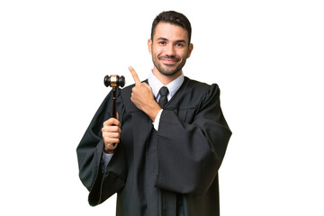 Judge caucasian man over isolated background pointing to the side to present a product