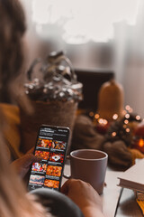 autumn photo on table with candles watching smartphone