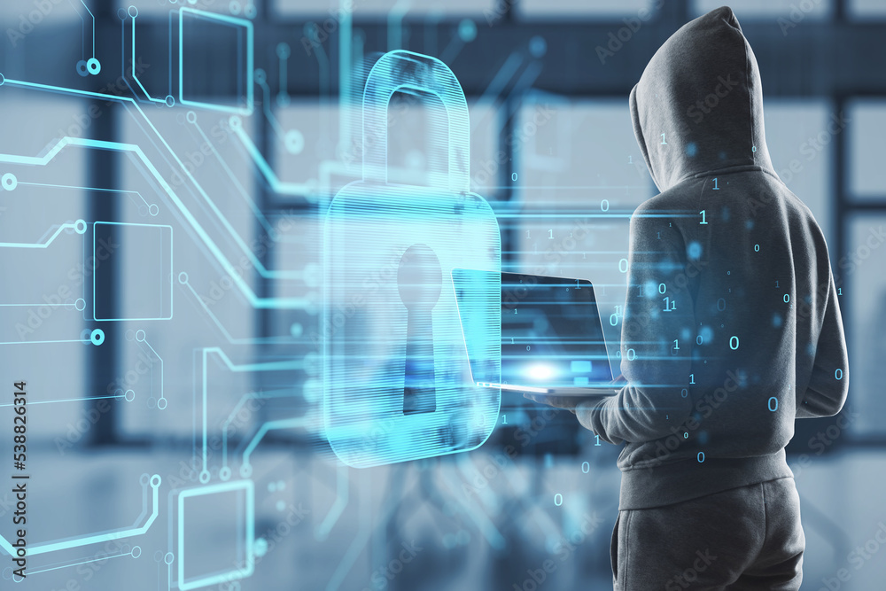 Poster hacker using laptop in interior with abstract glowing padlock hologram on blurry office background. 