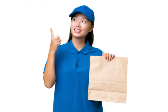 Young Asian woman taking a bag of takeaway food over isolated background pointing up a great idea