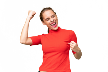 Young caucasian woman over isolated background celebrating a victory