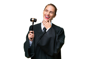 Naklejka premium Judge caucasian woman over isolated background looking up while smiling