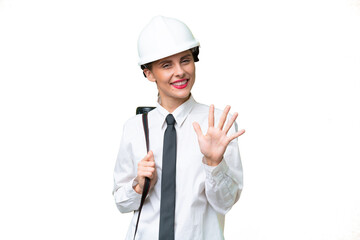 Young architect woman with helmet and holding blueprints over isolated background counting five with fingers