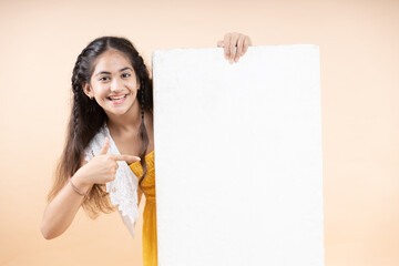 Young girl  holding a blank board with thumbs up