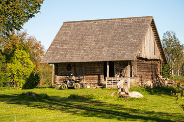 traditional Latvian rural homestead, barn and yard