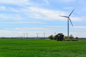 Fototapeta na wymiar windmill wind turbines in field, power generator electric pylon wind turbine