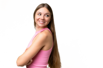Young beautiful blonde woman over isolated background with arms crossed and happy