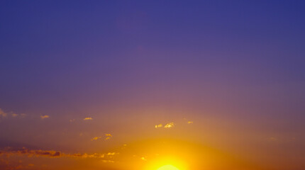 Beautiful colorful dramatic sky with clouds at sunset or sunrise.