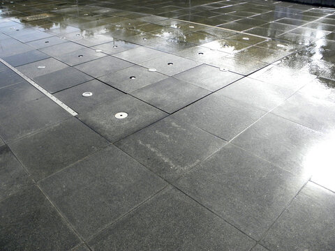 Wet And Slippery Floor Of Fountain, Low Angle Reflection