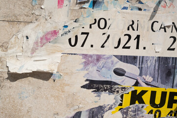 Torn street poster abstract background collage with ripped paper texture