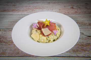 Recipe for risotto with dry ham, parmesan and rocket. High quality photo