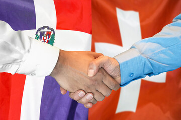 Business handshake on background of two flags. Men handshake on background of Dominican Republic and Switzerland flag. Support concept