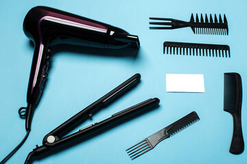 combs and hairdresser tools on blue background top viewcombs and hairdresser tools on blue background top view
