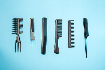 combs and hairdresser tools on blue background top viewcombs and hairdresser tools on blue background top view