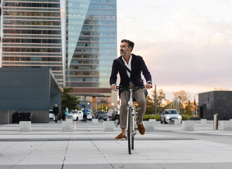 Commuter crossing road riding bicycle in city