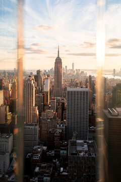 USA, New York, New York City, Midtown Manhattan at sunset seen through window