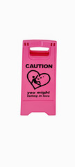 Caution pink sign for warning, falling in love, on a floor