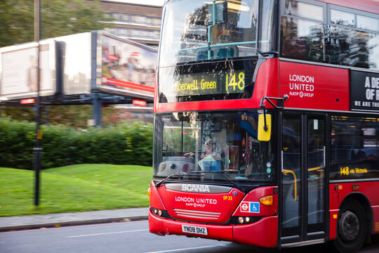 London traffic scene with moving Double Decker bus