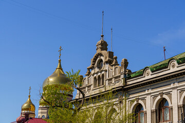 Urban landscape with a view of the beautiful dome of an ancient building. Vladivostok