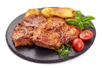 Roasted juicy pork steak with vegetables, fried meat, isolated on white background.