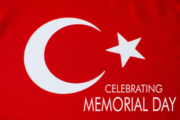 Celebrating Memorial Day is written on the Turkish flag.
