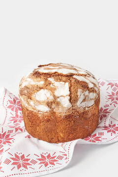 Freshly baked panettone cake on embroidered napkin