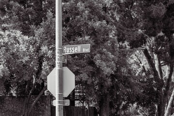 Grayscale shot of Russell Blvd street sign in Davis, California