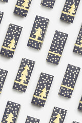 Stylish christmas paper gifts pattern, wrapped paper gift boxes on white fon, polka dot packages, boxes for holidays. New Year gifts decorated golden paper fir. Christmas flat lay photo