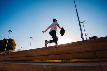 Businessman climbing career ladder in business concept